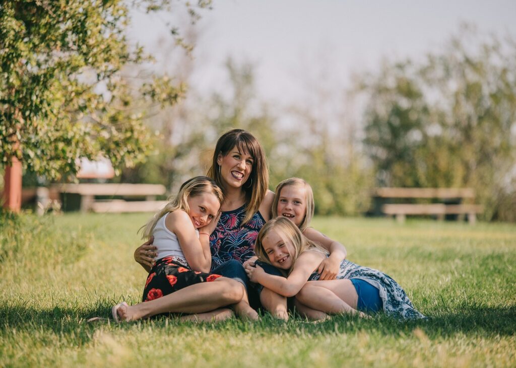 family, mother, daughters, lawn, grass, outdoors, nature, hugs, portrait, caucasian, mom, happy mothers day, mum