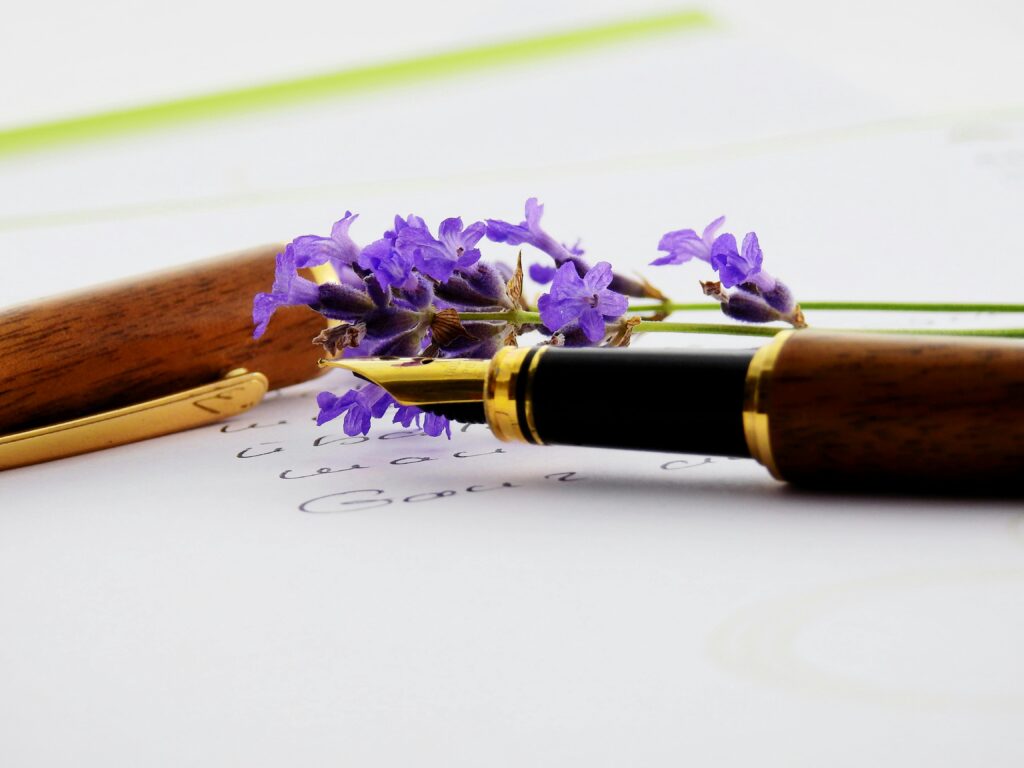 What Happens to Your Crypto When You Die Close-up of a fountain pen with lavender on paper, perfect for writing and floral themes.