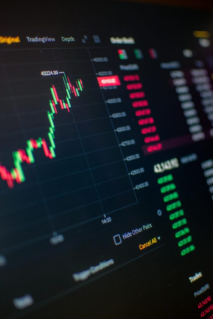 How to Read a Crypto Price Chart for Beginners Close-up of a digital screen showing cryptocurrency market trading graph and data.