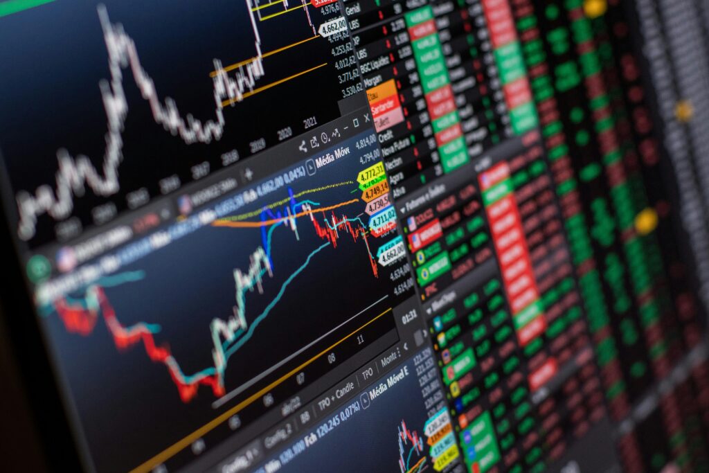 What Is Crypto Market Cap and Why Does It Matter Detailed view of stock market charts and data on a monitor, showcasing market trends.
