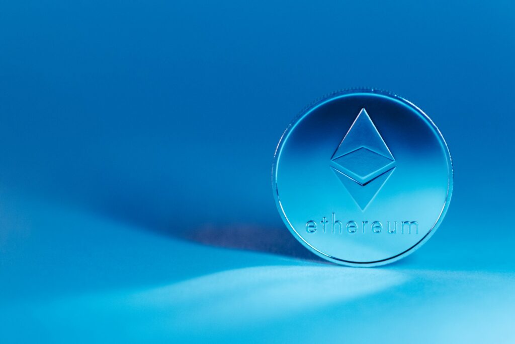 What Is Ethereum and Is It Worth Investing In A minimalist image of an Ethereum coin on a blue background, highlighting modern finance.