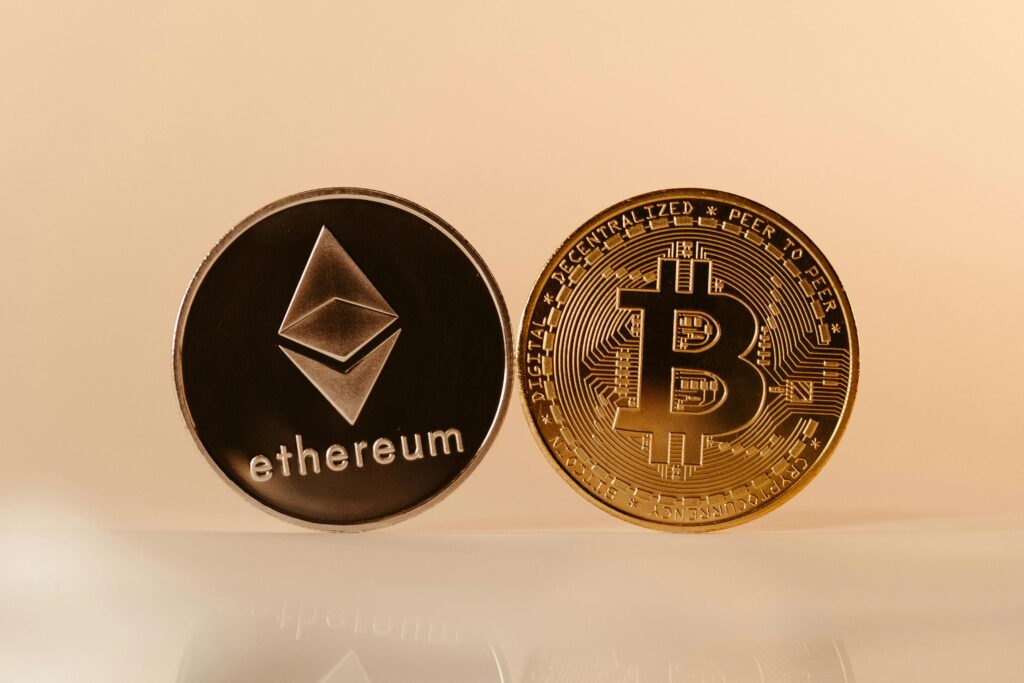 Bitcoin or Ethereum Which Should You Buy First Close-up of Ethereum and Bitcoin coins representing modern digital currency and blockchain technology.