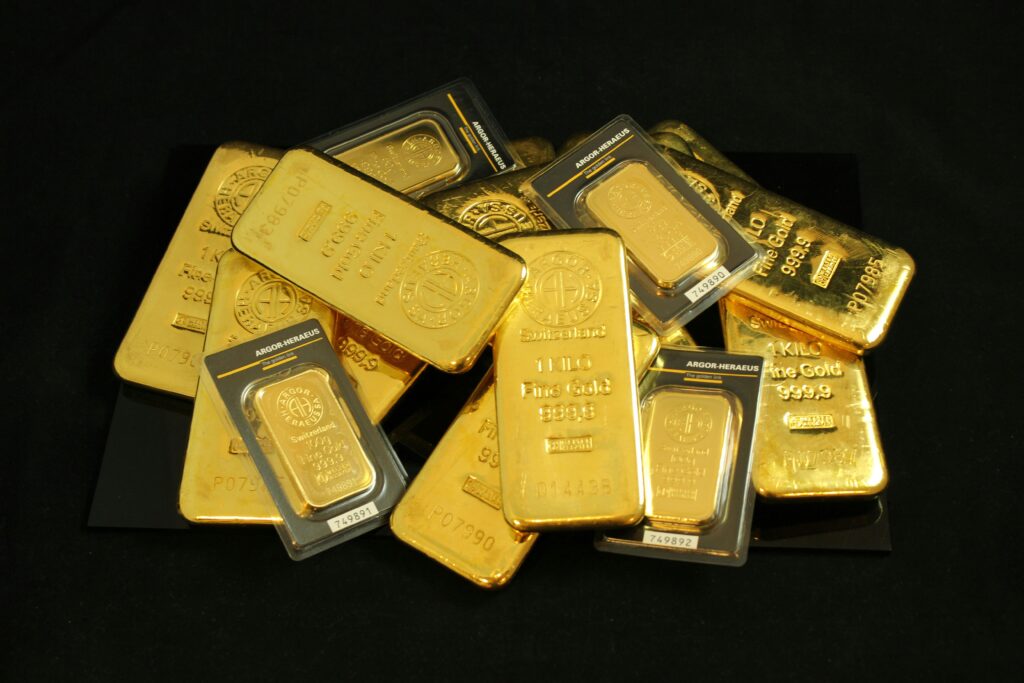 Bitcoin vs Gold: Which One Protects Your Wealth A collection of precious gold bars stacked elegantly, symbolizing wealth and prosperity.