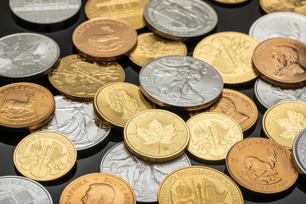 Why Crypto Price Per Coin Tells You Almost Nothing A detailed view of various gold and silver coins, ideal for financial themes.